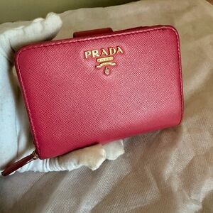 Prada Saffiano Leather Compact Wallet in a Fuchsia color Wallet